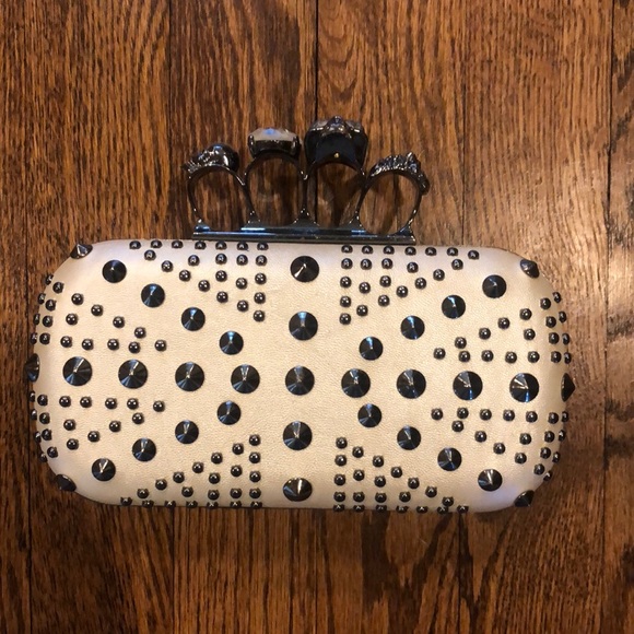 Handbags - Skull and jeweled brass knuckle handle studded cream clutch with 2 chains